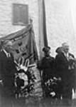Rt. Hon. W.L. Mackenzie King with Polish veterans in front of the plaque commemorating the Battle of the Windmill 1 July 1938