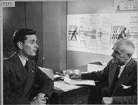 An official of the Department of Veterans' Affairs interviewing Mr. Jack Bryson (left) at the time of his discharge from the R.C.A.F Sept. 1945
