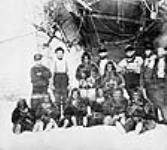 Latitude 76 degree N. at Cape York [N.W.T.]. Group of Arctic Highlanders and Seamen of the Expedition 1875 - 1876.