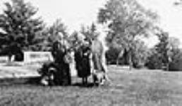 Rt. Hon. W.L. Mackenzie King with his dog Pat I and Etta Wriedt and Joan Patteson ca. 1935 - 1940