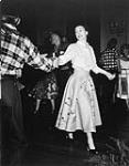 Visit to Canada of Their Royal Highness the Princess Elizabeth and the Duke of Edinburgh 'Grand Chain all' - the square dance at Government House c.a. 1951.