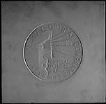 Plaster model for proposed medal for the Imperial Optical Company, established 1900. Awarded for Optical Scienec & Skill ca. 1950?