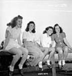 Female employees of the Dominion Arsenals Ltd. plant spend a day off in Sainte-Foy, Quebec 24 Aug. 1942