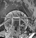 Inside view of tunnel A, showing the wooden form which will hold inside it a wall of concrete; Shipshaw Power Development Project janv. 1943
