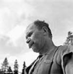 Swedish lumberman Matt Larsen, one of the oldest and strongest of the veteran lumbermen avril 1943