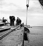 View from the deck of an aircraft carrier escort vessel of the round-down being removed at the Burrard Dry Dock mai 1944