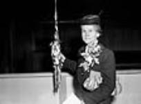 Female guest of honour at the launching of a ship from the Burrard yards 21 oct. 1944