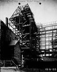 Justice Building under construction, Bank of British North America on the left (demolished) 18 June 1935