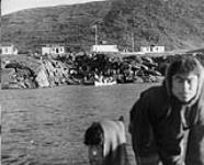 The unloading wharf [Sikuliaq (left), Mosesie Naulalik (right).] 1950