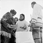 Governor General's Northern Tour. Governor General Vincent Massey enjoys a joke with English-speaking Inuit man, Special Constable Etouloupiac at Frobisher Bay, N.W.T March 1956.