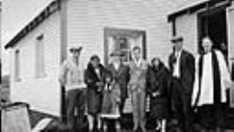 Three Inuit with Pete Norberg, Richard S. Finnie, Mr. and Mrs. Semmler and Rev. J.H. Webster 1930
