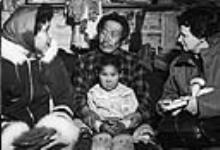 Nurse Desrochers is receiving health information through the Inuit interpreter Leea 1959