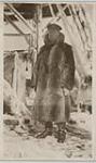 H.M.C.S. Niobe [Unidentified officer in a fur coat aboard an ice and snow covered Niobe] 1910-1915
