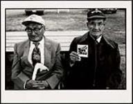 Two Hän elders, including Joe Henry (L), holding a polaroid they had taken of photographer David Trattles 1996.