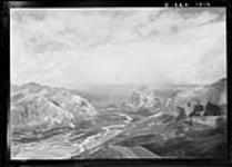 Red Deer River Valley, Banff National Park, Warden Rock near photo centre, South End of Wapiti Mountain visible at photo left. The West of the Ya-Ha-Tinda Ranch is visible beyond Warden Rock. View North East from Station 212 on Mount White, Banff National Park 1918
