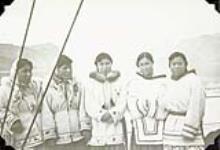 Five unidentified Inuit women on board a ship at Pangnirtung [Left to right: Rosie Okpik, Peepee Qupee, Annie Maniapik, Ida Qaqqasiq, Evie Pilattuaq.] 1952