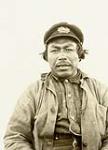 Portrait of an unidentified Inuk man wearing a captain-style hat [graphic material] 1926
