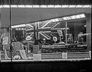 Window display at Simpson's store of two models of Canadian National Railways (CNR) locomotives - Dorchester and Loco 6100 1932