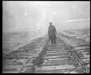 Nugent M. Clougher on unballasted track, Owl River, Hudson Bay Railway, Oct. 1928 Oct. 1928.