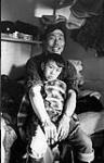 Kov and a young boy in his home [graphic material] April 1968