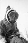 Inuit boy wearing a parka with a striped hood [graphic material] ca. 1966