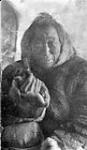 Elderly Inuit man holding a pipe in his hand [graphic material] ca. 1926 - 1943.