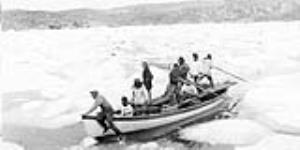 Inuit group on boat in ice floes July, 1935