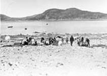 Inuit collecting supplies on shore 1929