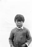 Inuk child wearing a stripped outfit July, 1926