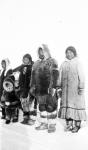 Inuit, dressed in caribou parkas, who were part of L.T. Burwash's party crossing Boothia Peninsula April, 1926