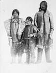 Unidentified Inuit family - mother, father and son ca. 1929-1934