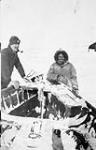 Unidentified Inuit man and white man vers 1929-1934.