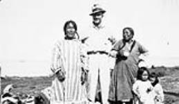 Unidentified Inuit women and children with Al Jensen [graphic material] ca. 1930-1943