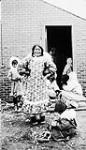 Unidentified Inuit woman and children [graphic material] ca. 1930-1943