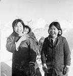 Two Inuit girls and baby on an island in the Gulf of Boothia 1949
