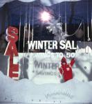 Store window display advertising a winter sale of children's clothing 1976-1978.