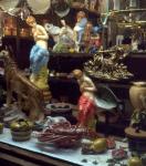 Window display of antique store on Queen Street West showing small statues and other trinkets 1976-1978.