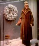 Store window display of a mannequin wearing a fur coat in a shop on Bloor Street West 1976-1978.