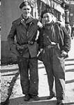 Augusto 1936, San Sebastian [two men standing on a street in San Sebastian, Spain] Aug. 1936.