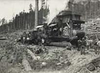 [Steam donkey loaded with lumber] 1936-1937.