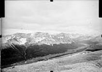 Southwest view at Station 5-4, valley of Mawitch Creek, camera station No. 13 just left of centre 1927