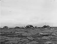 A photograph of the type of houses Inuit people live in on Southampton Island (Shugliaq), Nunavut 1948.