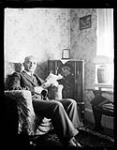  Portrait of Mr. Tatarian sitting in a living room chair holding a magazine 4 juillet 1936