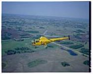 Aircraft- Sikorsky Helicopter. Side view from high angle. Aircraft going left. 1961