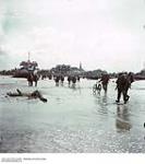 Infantrymen from Canada Landing on a French Beach ca. 1943-1965.