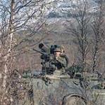 [M113 armoured vehicle fitted with a TOW launcher and .50 caliber mounting taking part in Exercise BRAVE LION] 1986