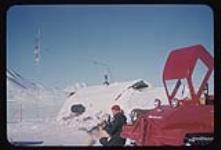No. 11 - Red J-5 snowmobile, man and hut 1957-1958.