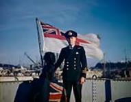 Lt. Commander, Royal Canadian Naval Reserve, and ship's mascot - dog [ca. 1942-1945]