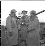 Near Grave - Warco Douglas Amaron interviewing two British members of a Bofors gun crew defending a vital bridge February 11, 1945.