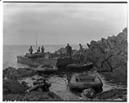 [LCA ,rubber craft and crew by shoreline] [ca. 1944].